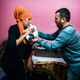 Suleiman performs a Muslim naming ceremony for a two-week old baby.